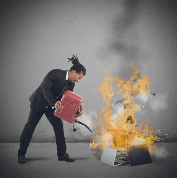 Businessman burns computers Stock Photos