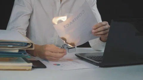 Businessman burns paper contract document. Destruction of securities Stock Footage 85063183
