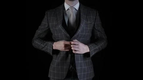 Businessman Buttoning Suit Jacket On Black Background 库存影片 335188465