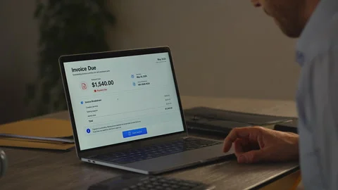 Businessman Calculating Payment Due While Reviewing Invoice Dashboard Stock Footage 337137582