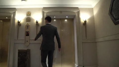 Businessman calling the elevator Stock Footage 232923794