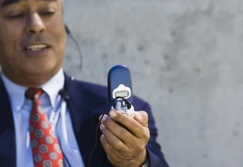 Businessman on cellular headset Stock Photos