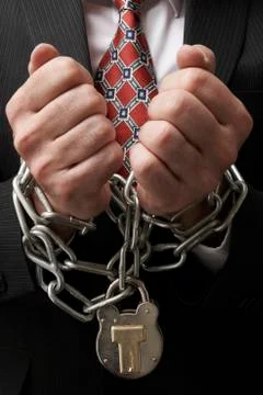 Businessman in chains Stock Photos