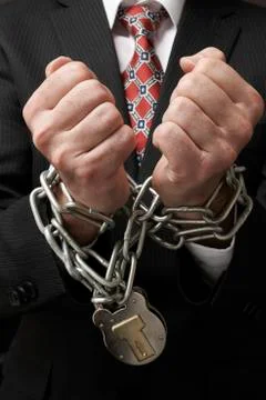 Businessman in chains Stock Photos