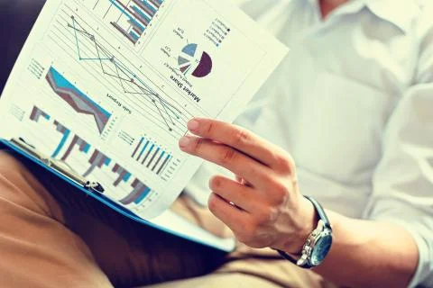 Businessman check calculate data. document graph chart and report marketing.  Foto stock