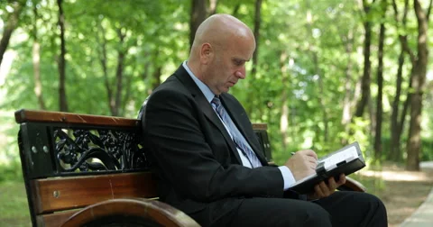 Businessman Check Write Agenda Note Park Alley Nature Background Man Sit Bench Stock Footage 50139641