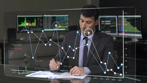  Businessman Checking Charts In Office Video stock 210232823