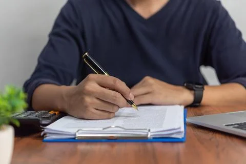 Businessman checking document data accounting and paperwork tax finance or .. Stock Photos