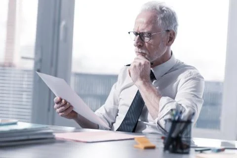 Businessman checking a document 写真素材