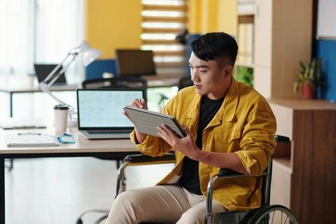 Businessman Checking Document on Tablet Fotos de archivo