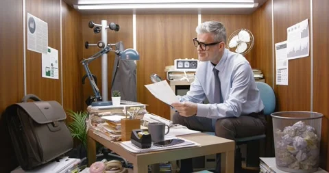 Businessman checking a document using a magnifier Stock Footage 309020465