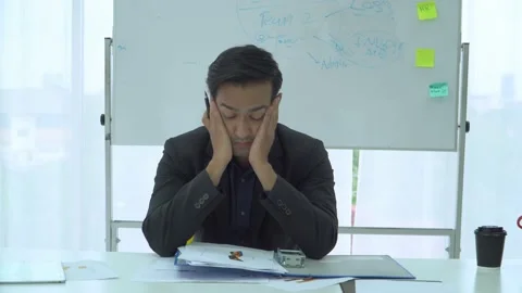 Businessman checking documents stressed and tired in office Stock Footage 156703381