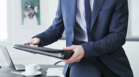 Businessman checking a file of documents Stock Footage 68395877