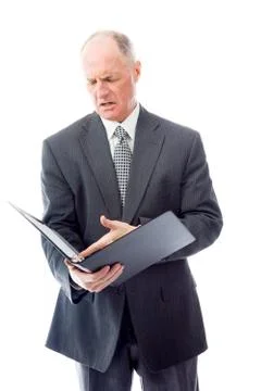 Businessman checking a file Stock Photos