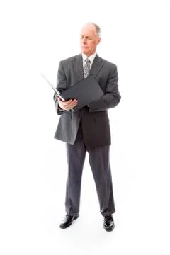 Businessman checking a file Stock Photos