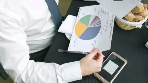 Businessman checking graphs and having a success, steadycam shot 動画素材 61264867