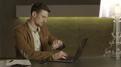 Businessman checking hour on his watch Stock Footage 68546462
