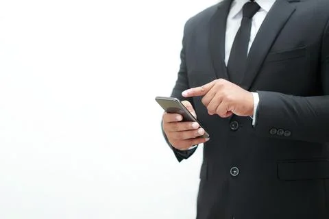 Businessman checking mobile Smartphone and mobile device technology to determ Stock Photos