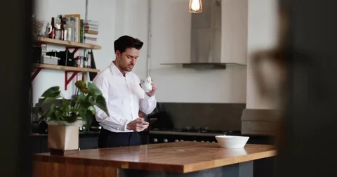 Businessman checking smartphone at home Stock Footage 85230908