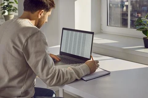 Businessman checking spreadsheet on computer screen in office Stock Photos