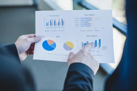 Businessman checking stats Stock Photos