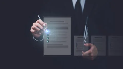 Businessman checking the steps through document with a list of checkboxes ,.. Stock Photos