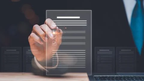 Businessman checking the steps through document with a list of checkboxes ,.. 스톡 사진