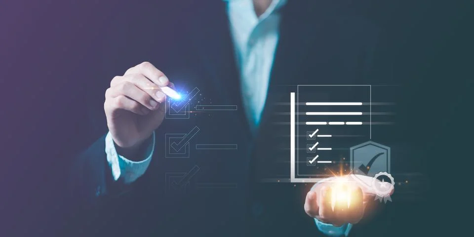 Businessman checking steps through document with a list of checkboxes ,regu.. Stock Photos