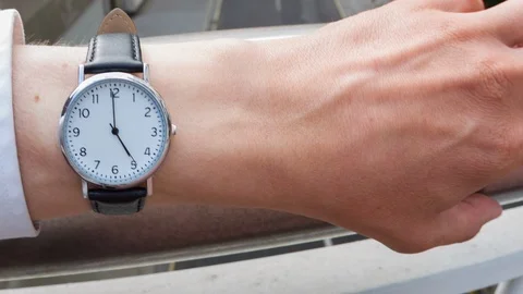 Businessman checking the time Video stock 104045705