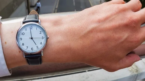 Businessman checking the time Video stock 104046282