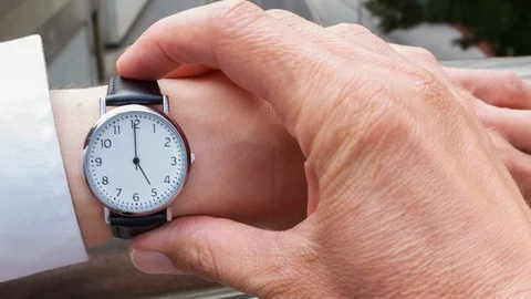 Businessman checking the time Video stock 104046873