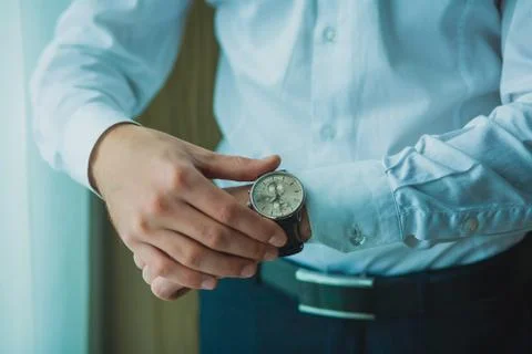 Businessman checking the time Stock Photos