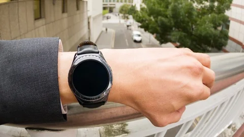 Businessman checking the time on a smartwatch Video stock 104047535