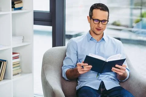 Businessman cheking notes in notebook Stock Photos