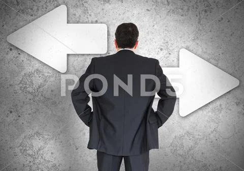 Businessman choosing which direction to go Stock Photos