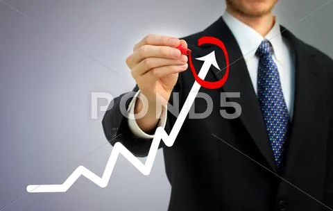 Businessman circling a rising arrow Stock Photos