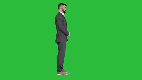Businessman clapping hands impressed by something on a Green Screen, Chroma Key. Stock Footage 125456109