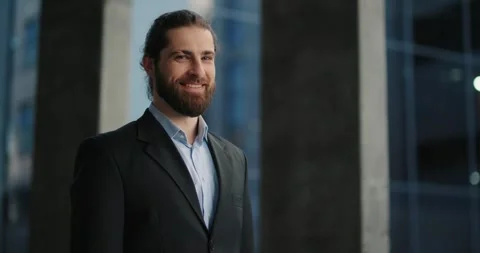 Businessman in classical suit looking in camera objective and smiling. Stock Footage 246753771