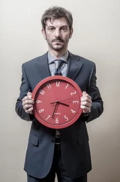 Businessman with clock Stock Photos