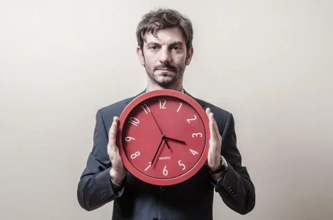 Businessman with clock Stock Photos