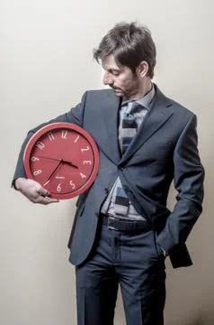 Businessman with clock Stock Photos