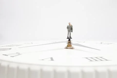 A businessman on a clock Stock Photos