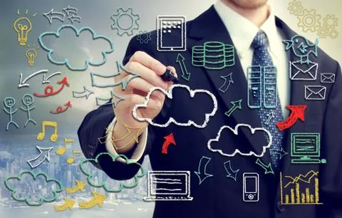 Businessman with cloud computing themed pictures 写真素材