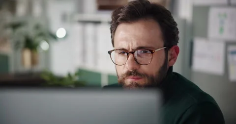 Businessman, computer and serious with reading in office for editing, fast Stock Footage 316765032