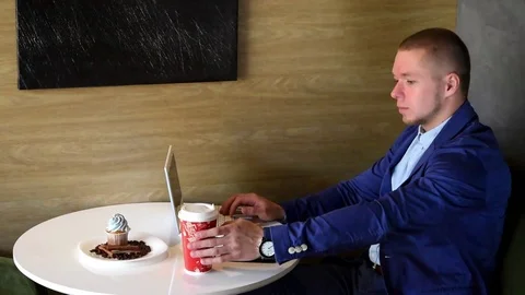 Businessman at the computer in the coffee shop Stock Footage 74248047