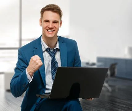 Businessman with computer in office Stock Photos