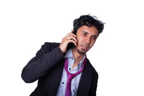 Businessman with concerned expression while talking on the phone. Business man Stock Photos