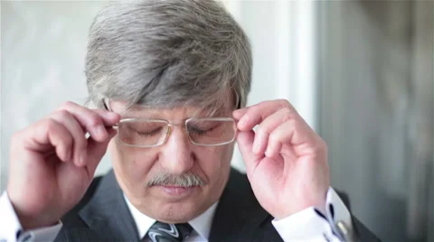Businessman corrects glasses Stock Footage 67514002