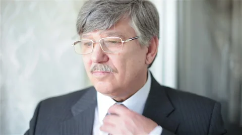 Businessman corrects tie Stock Footage 67514142