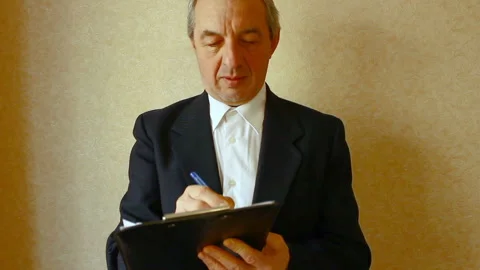 The businessman costs, does notes on paper. Stock Footage 87042138